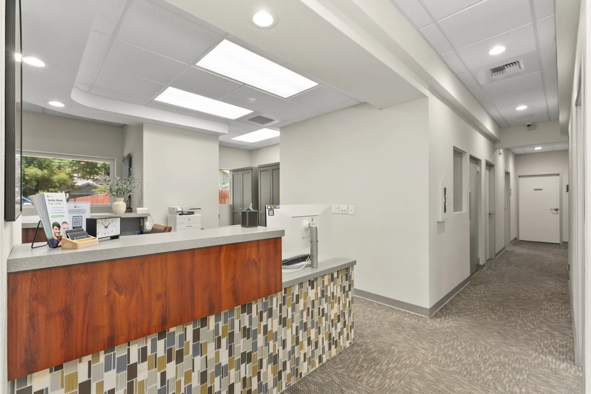 Reception desk and corridor at Artisan Dentistry